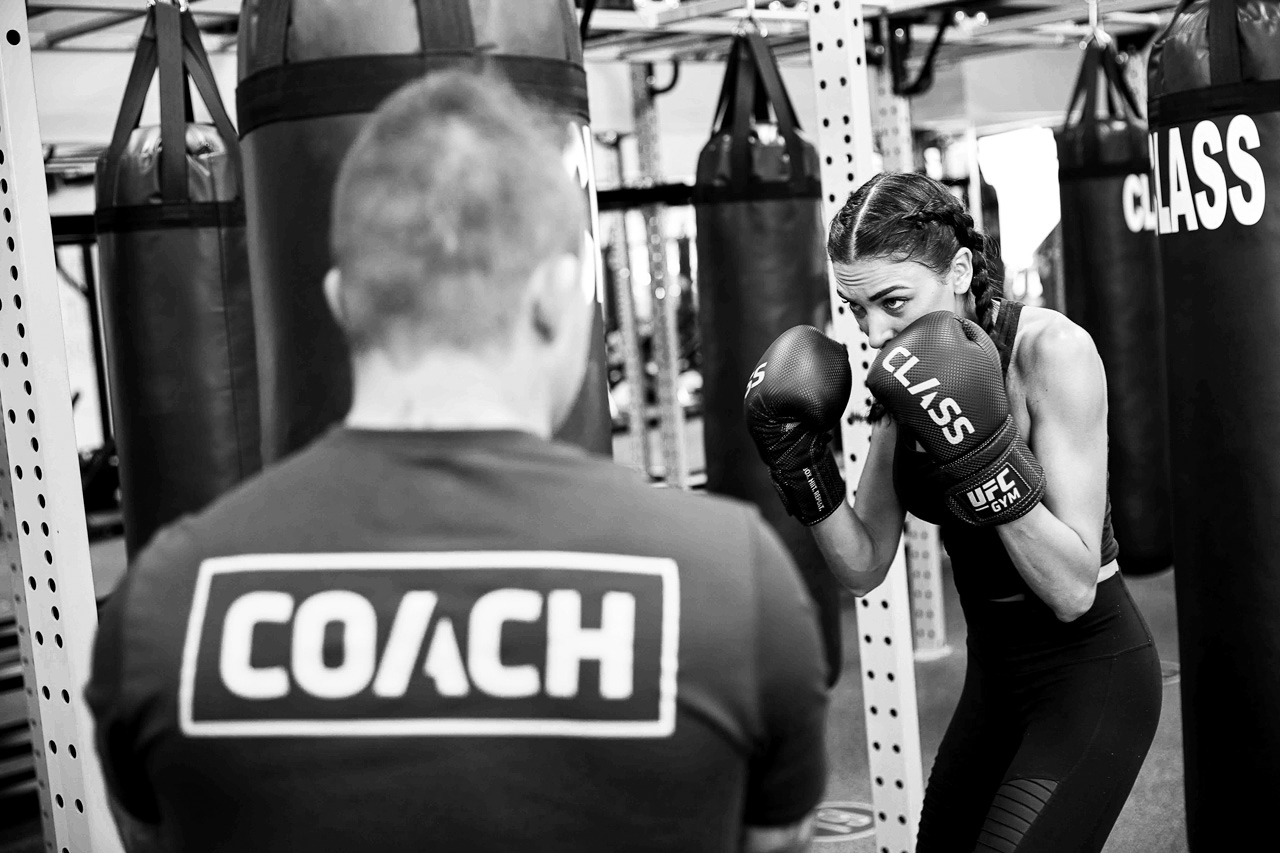 Member and coach punching together
